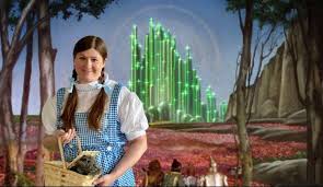 Michelle Gibbons in a Dorothy costume in front of the Emerald City