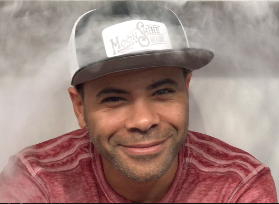 Headshot of David Hunt, smiling and wearing baseball cap.