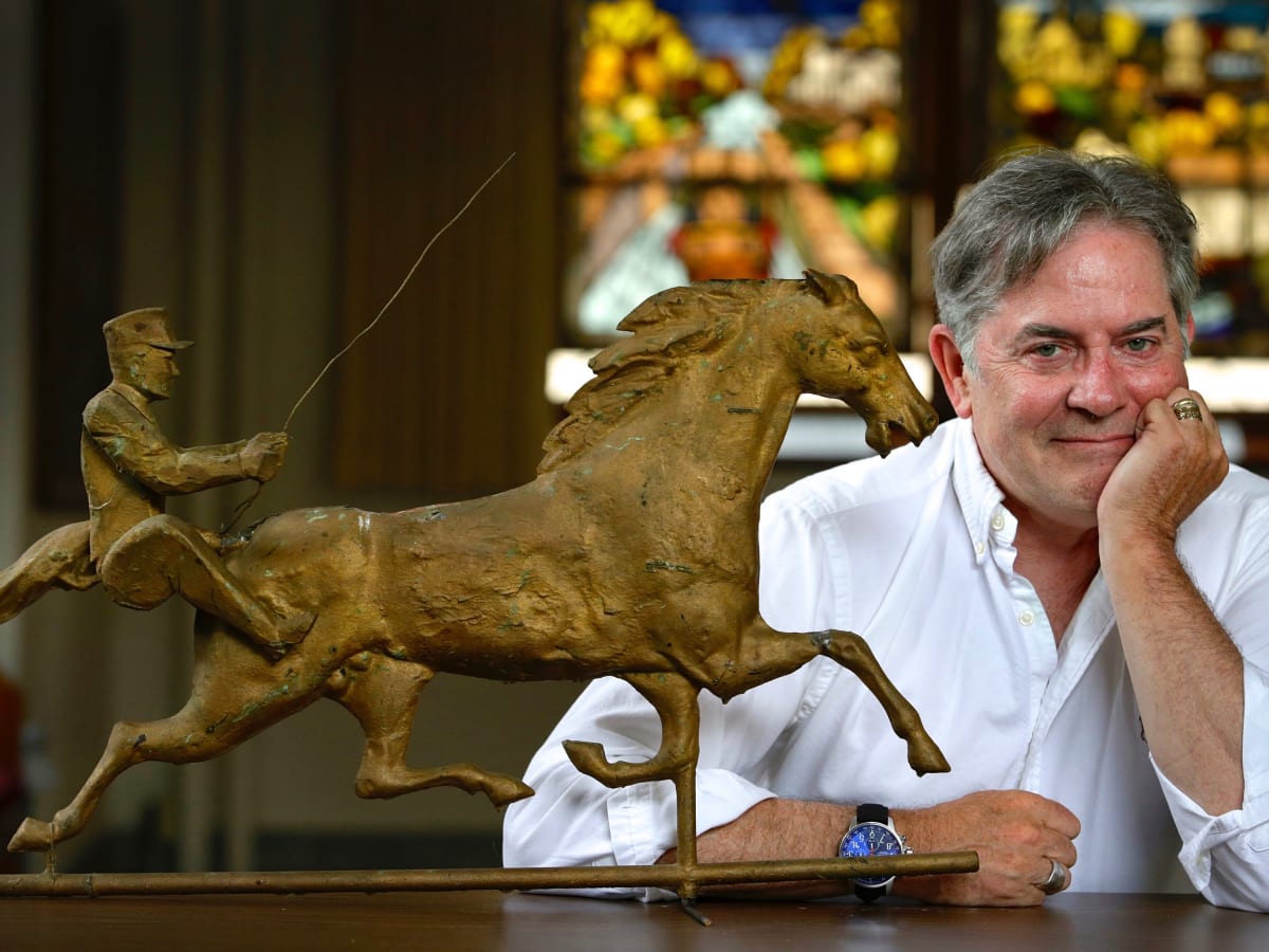 Mark Weathervane next to an antique horse statue