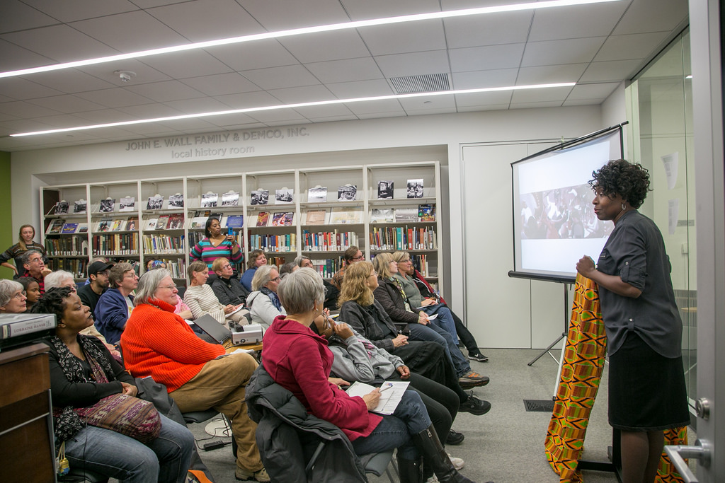 A writer addresses the audience at DeForest Public Library