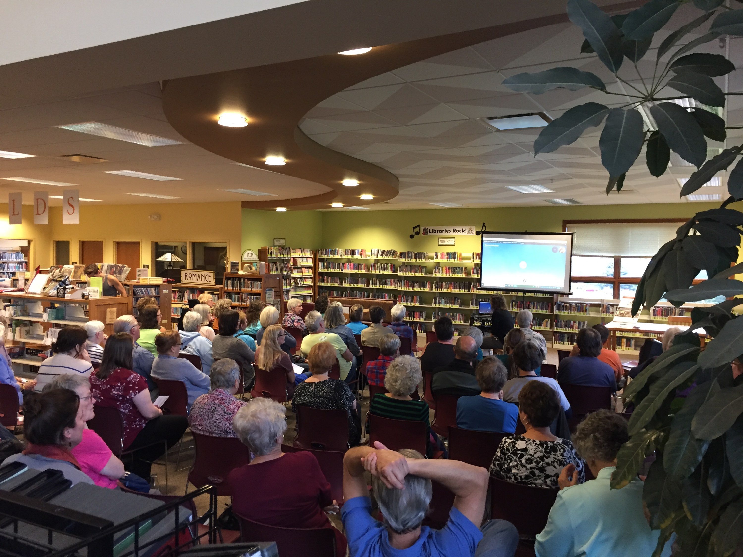 Mount Horeb Library Event with attendees looking at Skype projected on screen